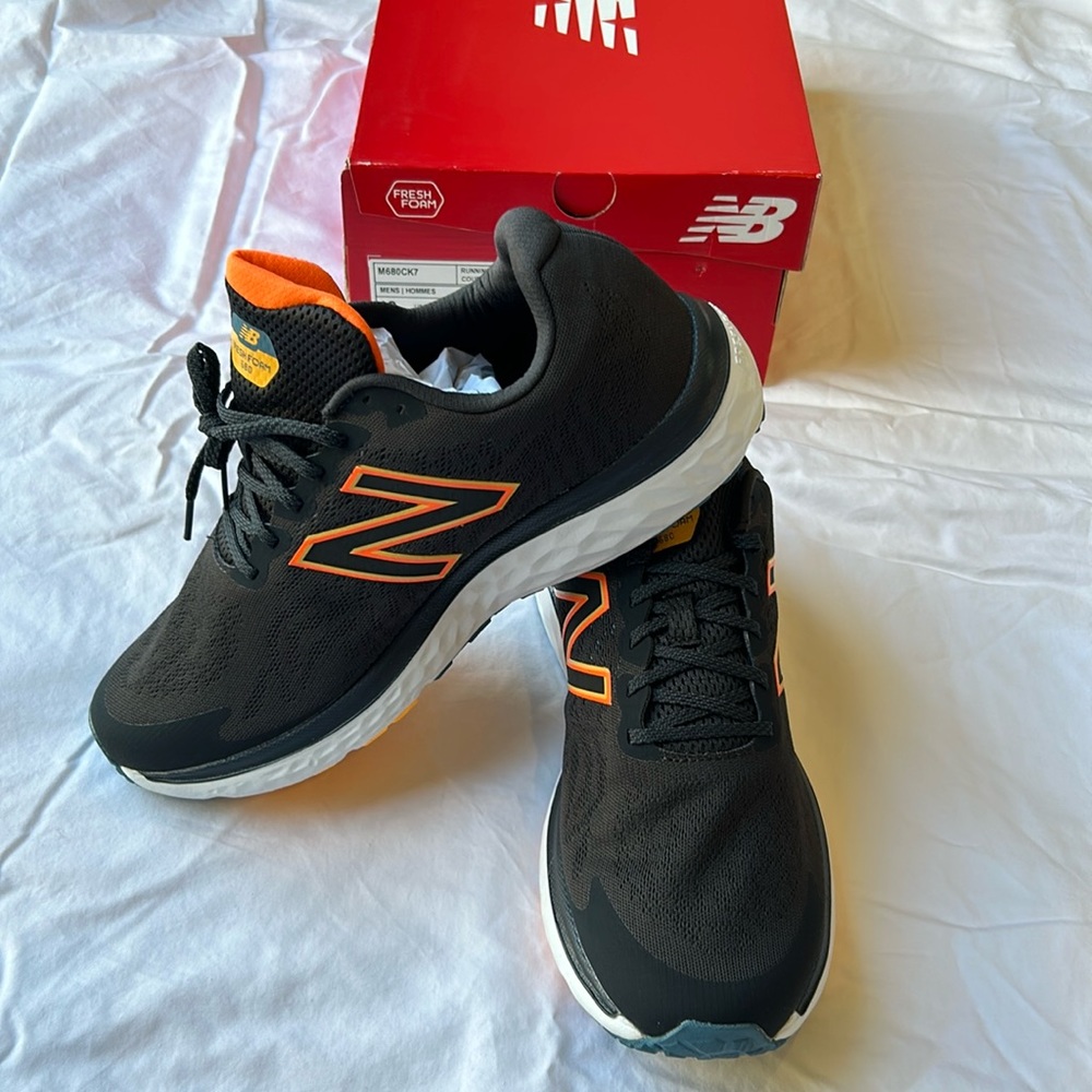 Black and orange New Balance Fresh Foam 680v7.  Size 12 Never been worn.